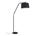 Lampada da terra moderna nera e dorata con paralume in tessuto Kepas Promozione